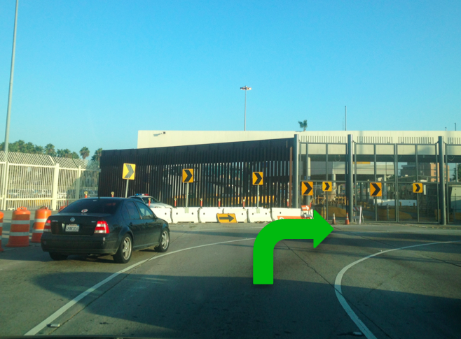 1. You’ll approach the old border crossing. Follow traffic to make 90 degree right turn.
