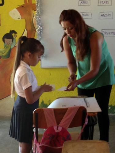 Mayra Aguilar, who's life is profiled in the new documentary film "La Maestra," works with a student in her 2nd Grade classroom. Photo: Elizabeth Pepin Silva